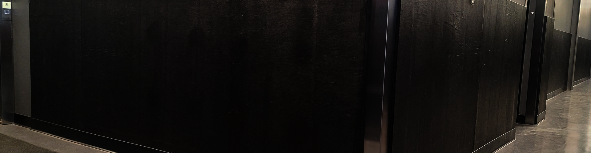 corner of hall way with black walls